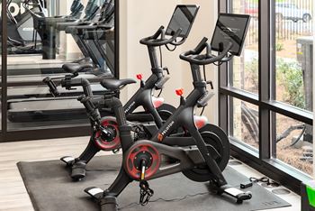 A stationary exercise bike is in a gym.